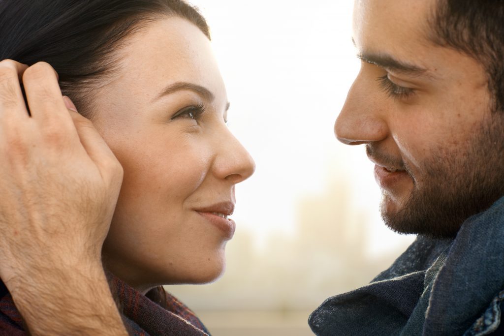 man looking into woman's eyes