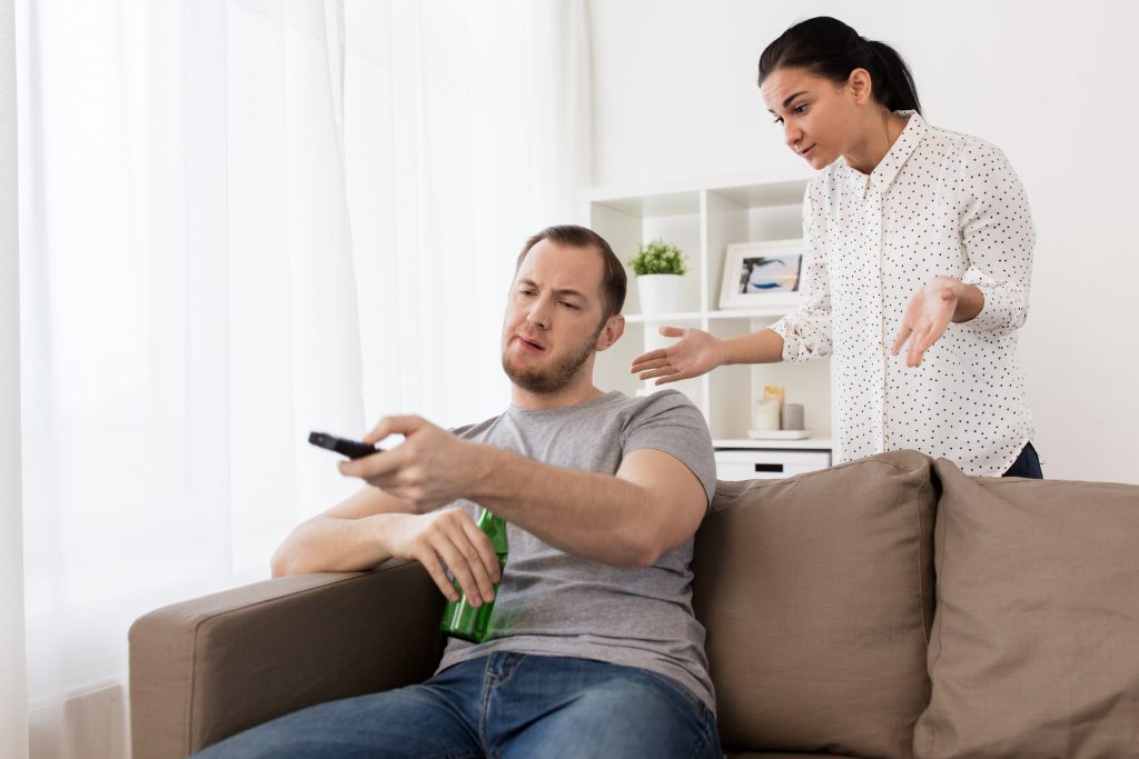 girlfriend annoyed with lazy man