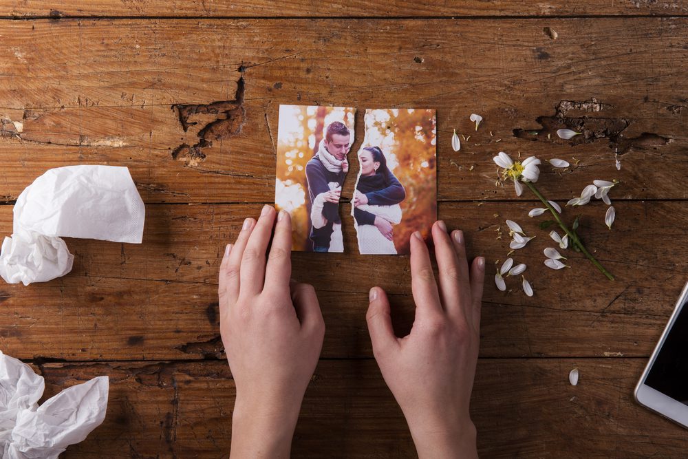 torn photo of couple